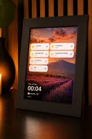 Picture frame mode on a small framed tablet with HA scene buttons and wallpaper