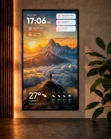 Wall-mounted portrait monitor as family board with clock, calendar, notifications, and weather