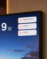 Close-up of notification tiles showing washing machine done, feed reminder, dryer done